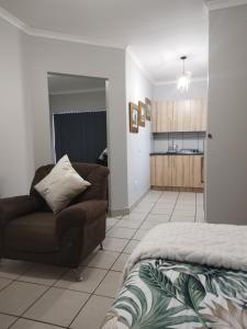 a living room with a couch and a kitchen at The Gather Inn Bethlehem in Bethlehem