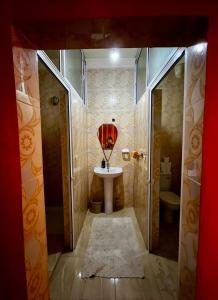 a bathroom with a sink and a toilet at Dar Zina in Aourir