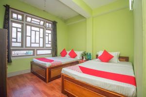 Postel nebo postele na pokoji v ubytování Hotel O Demadzong