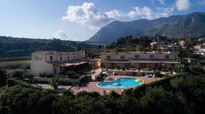 an aerial view of a house with a swimming pool at Riva Sea Apartments in Castellammare del Golfo