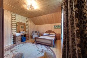 Un pat sau paturi într-o cameră la Guest House Velet