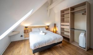 Ένα ή περισσότερα κρεβάτια σε δωμάτιο στο Le Napoleon