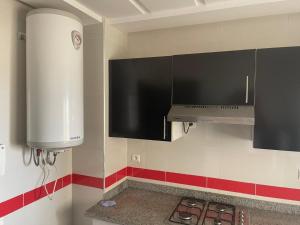 Køkken eller tekøkken på Magnifique Appartement à Louer C14 Jnane Dalya + 10 billeder