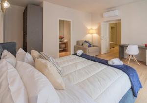 Ένα ή περισσότερα κρεβάτια σε δωμάτιο στο Bartolo Apartment