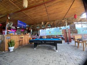 a pool table in the middle of a restaurant at hostel Big J in Vũ Lâm