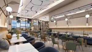 a restaurant with couches and tables and chairs at voco CAIRO ARABELLA PLAZA by IHG in Cairo