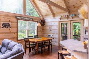 a dining room with a table and chairs in a cabin at Serenity Now in Fleetwood