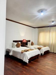 Postel nebo postele na pokoji v ubytování Paradise Angkor Villa + 20 fotografií