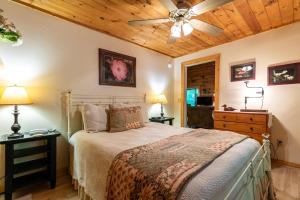 a bedroom with a bed and a ceiling fan at Trillium in Banner Elk
