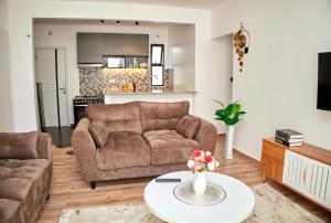 a living room with a couch and a table at Juwell Haven in Nairobi