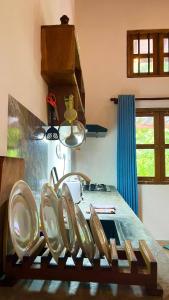 a kitchen with a table with a bunch of chairs at KAIMANA HOUSE - 3 Min walk to the beaches in Tangalle