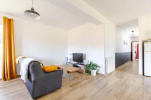 Et opholdsområde på Maison privée avec jardin Chez Marcelle