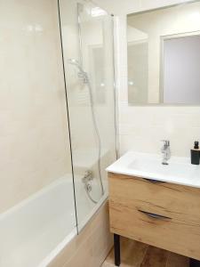 a white bathroom with a shower and a sink at Balcons G 013 - PARC NAT VANOISE appart 8 pers in Termignon +6 photos