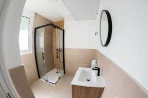 a bathroom with a sink and a shower at Lucky House in Seville