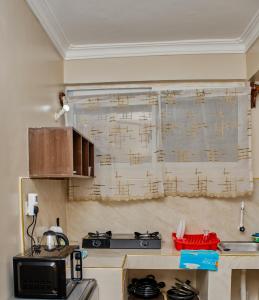 Kuchyň nebo kuchyňský kout v ubytování White Loft Diani