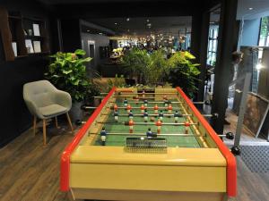 a foosball table with balls on it in a room at ibis Paris Bastille Opera in Paris