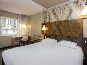 Ένα ή περισσότερα κρεβάτια σε δωμάτιο στο Ibis Brussels City Centre