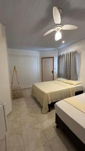 Giường trong phòng chung tại Pousada Luar