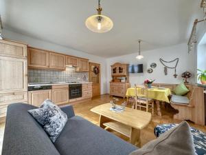 a living room with a couch and a table at Blumenhof II in Dietersdorf +40 photos