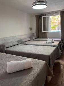 Ένα ή περισσότερα κρεβάτια σε δωμάτιο στο Mare Hotel Apartment