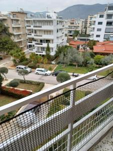 ein Balkon mit Blick auf die Stadt in der Unterkunft Sea and City Voula Suite by First Class Properties in Athen