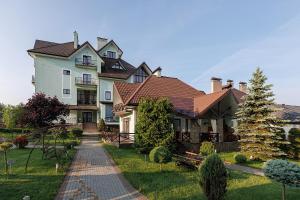 a large house with a pathway in front of it at Вілла "Синевір" in Skhidnitsa