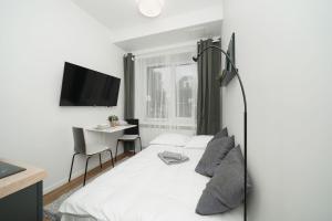 Voodi või voodid majutusasutuse Stylish Studio toas