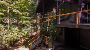 a house in the woods with a balcony at Elk Watch at Hound Ears in Valle Crucis
