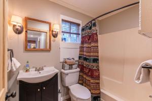 a bathroom with a toilet and a sink at Four Bear Falls in Banner Elk +17 photos