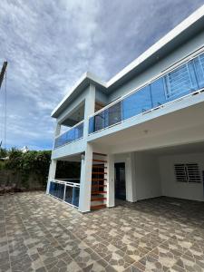 a large white house with a lot of windows at Villa Kayana en Las Galeras in Las Galeras