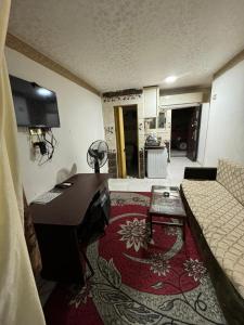 Kuchyň nebo kuchyňský kout v ubytování 6th of October Studios الحي الاول