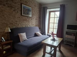 Posezení v ubytování La croix d'asquins