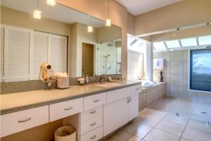 a bathroom with a sink and a large mirror at Kapalua Bay Villas 2 Free Rental Cars KBM Resorts Premium Bay Villa 2 Units 3 Bedrooms ML-1604 in Honokahua +28 photos