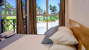 Postel nebo postele na pokoji v ubytování Buceo Inn Mathiveri