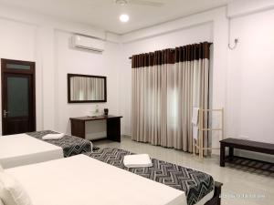 Postel nebo postele na pokoji v ubytování Coco Heritance