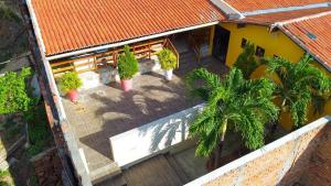 an overhead view of a house with palm trees at Pousada do Imperador in Piranhas +14 photos