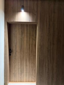 a wooden cabinet with a light on top of it at Suite Bahiya 11 in Fès +2 photos