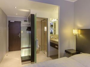 Postel nebo postele na pokoji v ubytování Mercure Hotel Potsdam City