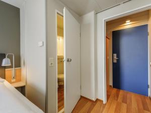 Ένα ή περισσότερα κρεβάτια σε δωμάτιο στο ibis Hotel Frankfurt Messe West +58 φωτογραφίες