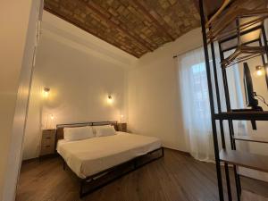 Ένα ή περισσότερα κρεβάτια σε δωμάτιο στο Enjoy Vatican Holiday in Rome