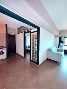 a living room with a couch and a table at 2 Bedroom City Centre Gibraltar in Gibraltar