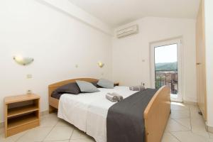 Posteľ alebo postele v izbe v ubytovaní Apartments Vela Luka