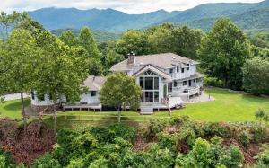 an aerial view of a large house with mountains in the background at Sunrise to Sunset in Hayesville