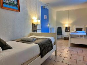 Postel nebo postele na pokoji v ubytování Les Callunes anciennement Le Beauséjour