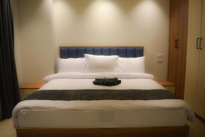 Katil atau katil-katil dalam bilik di Avenue Alarab Residence +43 gambar