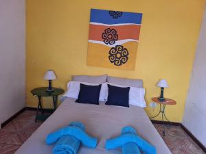 Ένα ή περισσότερα κρεβάτια σε δωμάτιο στο La Vecindad del Sol Depto E