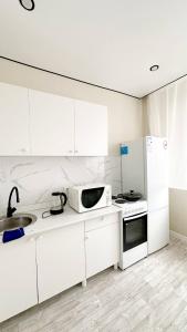 Kuchyň nebo kuchyňský kout v ubytování A cozy apartment in the heart of the city! + 4 fotografie