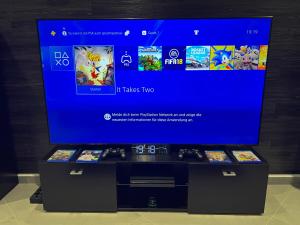 a tv screen with a video game console on display at Luxury Apartment Schwabach 2 in Schwabach