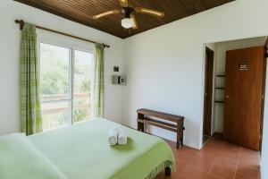 Postel nebo postele na pokoji v ubytování Posada La Pedrera