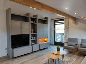 TV a/nebo společenská místnost v ubytování Ferienhaus Gioia